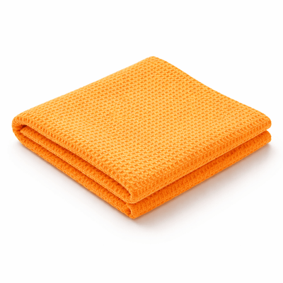 Orangefarbenes Glas trocknendes Tuch mit Waffelstruktur für ein streifenfreies Ergebnis